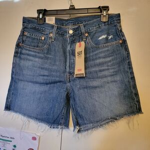 Levi's 501 High Rise Distressed Denim Shorts in Medium Wash